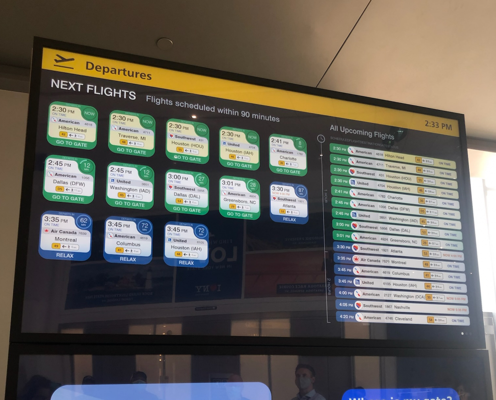 LGA Flight Information display with tiles and list of flights.