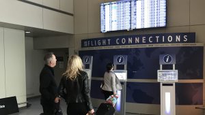 FIDS and baggage recheck screens in Terminal E at Boston Logan Airport