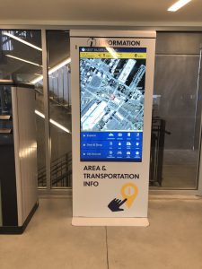 Wayfinding Kiosk inside the structure showing a map of the area and a menu of locations to search.